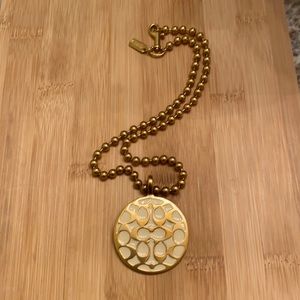 Coach Gold and Ivory Pendant Necklace